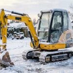Mini excavator winterized and stored in snow